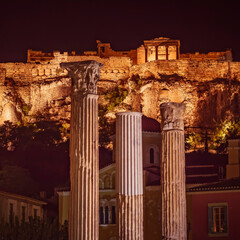 night scenery in Athens Greece, ancient temples on Acropolis hill and random columns, view from the...