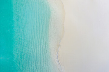 Summer seascape beautiful waves, blue sea water in sunny day. Top view from drone. Sea aerial view,...