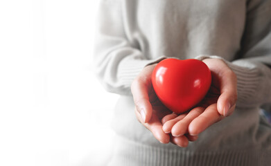 Red hearts with loving and caring adults. Symbol of support that expresses love valentine day and world heart day, heart health concept