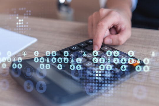 HR specialist researching and analyzing the data of salary on employment market to forecast ongoing expenses of the company. Hiring new talented officers. Social media hologram icons. Woman hand.