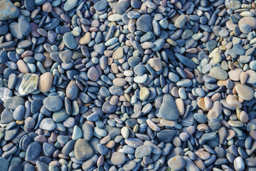 texture of sea colored smooth pebbles for background