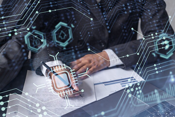 Two information technology specialist brainstorming on project to create a new approach to develop software to improve business service. Technological icons over the table with document.