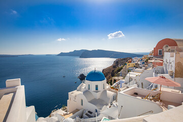 Obraz premium Santorini island, Greece. Amazing summer vacation landscape, white architecture and blue sea view over the caldera. Famous travel destination, urban travel background. Leisure lifestyle travelling