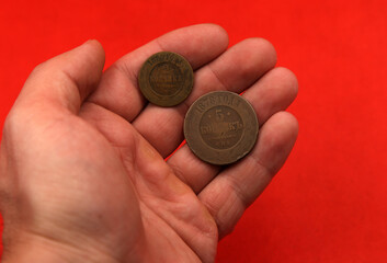 Vintage copper coins of Russian Empire in hand