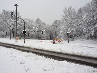Road blocked due to heavy snowfall. Impassable road covered in snow in the German town of...