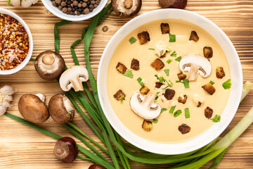 Cream soup of chestnuts on a wooden background. Top view.
