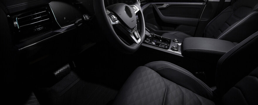 Luxury car black interior. Steering wheel, shift lever and dashboard. © Кристина Пахомова