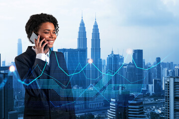Attractive black businesswoman pensively processing conference call by phone to find financial...