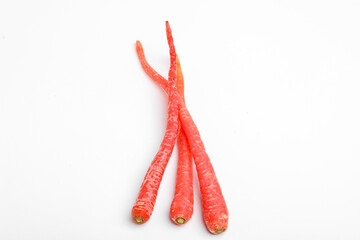 Fresh red carrot bunch on white background