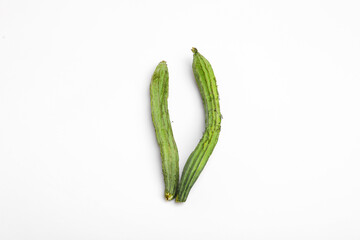 Farm fresh ridge gourds (angled luffa fruit) with isolated on white background
