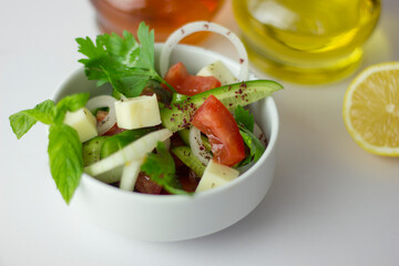 Green salad with onion, parsley, cucumber, tomato and feta cheese