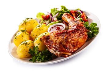 Roast chicken leg with boiled potatoes on white background
