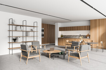 Modern white and wooden kitchen corner with bookcase and table