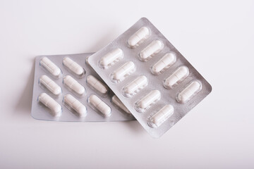 One kind of tablets on a white background. Concept of medicine. Pharmaceutical packging with pills. 