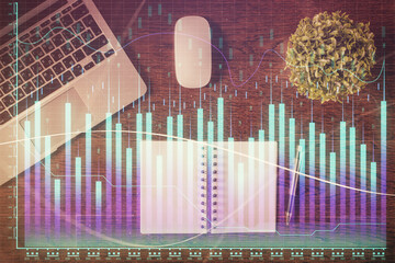 Stock market graph and top view computer on the table background. Double exposure. Concept of financial education.
