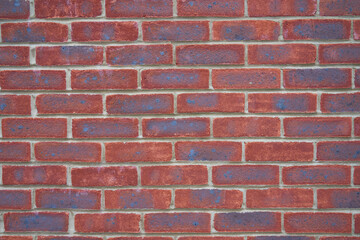 Red blue and grey brick wall
