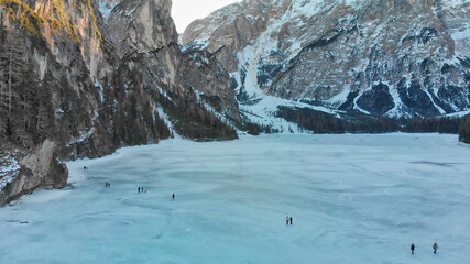 Fototapeta premium Braies Lake blotted in winter, aerial view from drone, Italian Alps