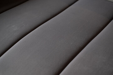 Gray colored velvet background. Soft fabric furniture backdrop.