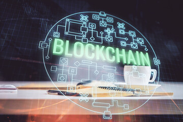 Double exposure of crypto technology drawing and desktop with coffee and items on table background....