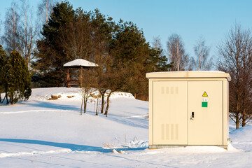 Outdoor electric cabinet on a sunny winter park