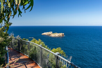 Obraz premium View of The Nuggets, a close group of 4 granite islets, seen from Cape Tourville Lighthouse near the Freycinet Peninsula, East Coast Tasmania, Australia. Penguins and seals are often seen on the rocks