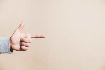 Close up image of male hand pointing.