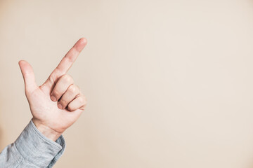 Close up image of male hand pointing.