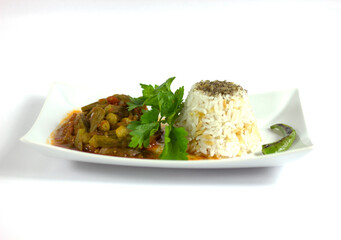 Okra with rice and parsley in a white plate