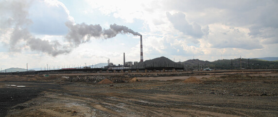 city with a pipe at the ore mining site