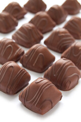 Chocolate praline on the white background