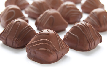 Chocolate praline on the white background