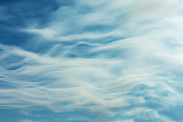 Sky of white and blue clouds forming ripples.