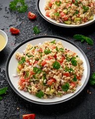 Tabbouleh salad with tomato, cucumber, red onion, bulgur and parsley. Healthy vegan food