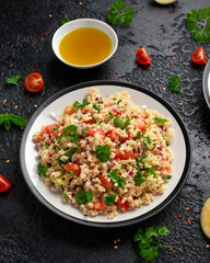 Tabbouleh salad with tomato, cucumber, red onion, bulgur and parsley. Healthy vegan food
