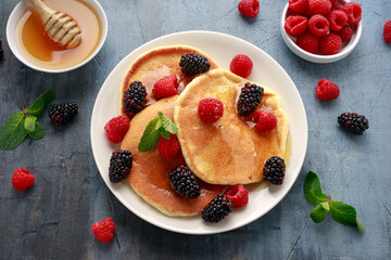 Morning breakfast Pancakes with fresh berry and honey. Healthy food