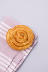 Homemade Freshly Baked Sweet Buns Rolls on Pink Napkin Vertical