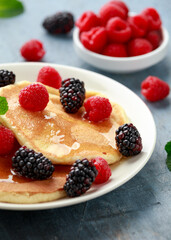 Morning breakfast Pancakes with fresh berry and honey. Healthy food