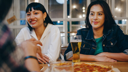 Group of happy tourist young Asian friend drinking alcohol beer and having fun laugh enjoy hangout party in night club at Khao San Road. Traveler backpacker Asia people travel in Bangkok, Thailand.