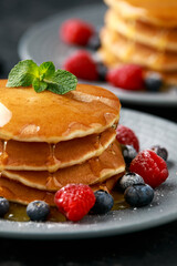 American pancakes with fresh blueberry, raspberry and honey. Healthy morning breakfast