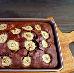 Fresh Baked Aromatic Homemade Dark Chocolate Banana Cake on the Kitchen Table