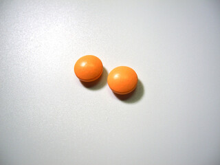 Tablets (dietary supplements) on a white background