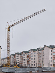 Construction of a large apartment building. High construction crane
