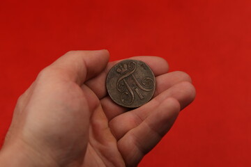 Vintage russian copper coin in hand