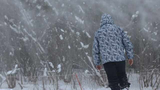 Skier leaves through a snowstorm