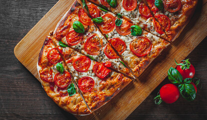 oval Pizza with Mozzarella cheese, Tomatoes, pepper, Spices and Fresh Basil. Italian pizza. Pizza...