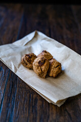 Cookies with Bran Flour and Raisin on Dark Wooden Surface.