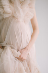 pregnant tummy in a pink dress