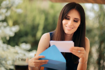 Happy Woman Opening an Envelope Receiving Good News
