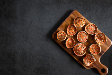 Top view of dried quince on a wooden cutting board