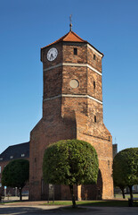 Fototapeta na wymiar Medieval townhouse tower at Freedom square in Znin. Poland